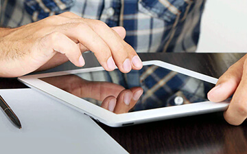 a person reading a book on a tablet
