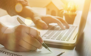 an author writing on a laptop