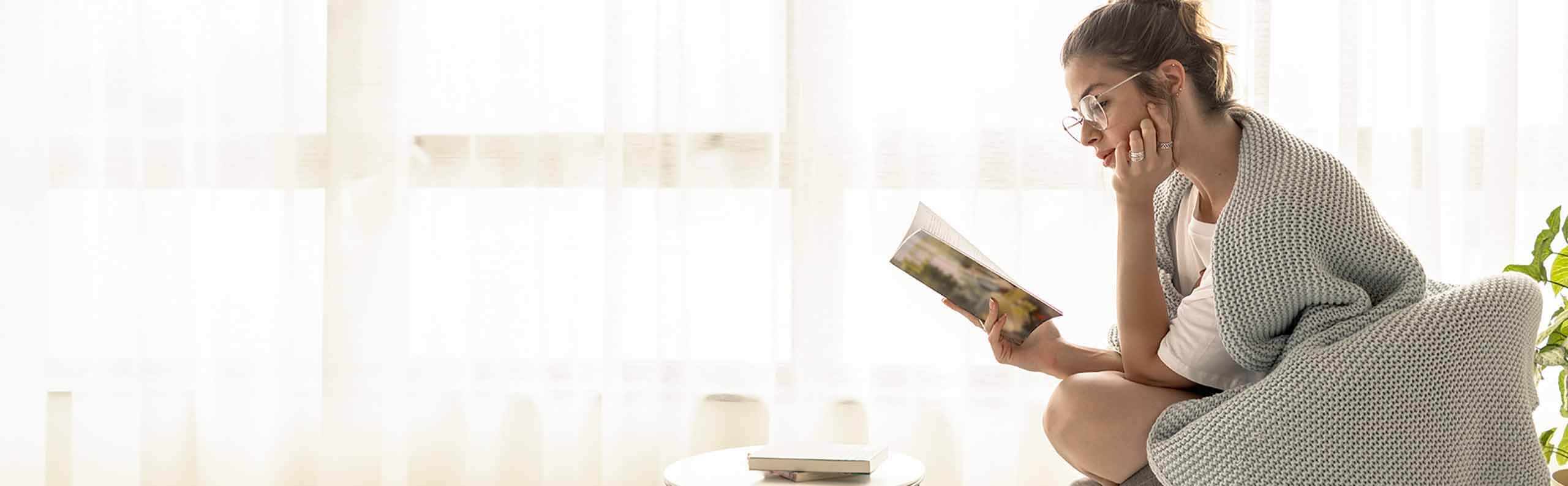 Woman invested in a romance novel