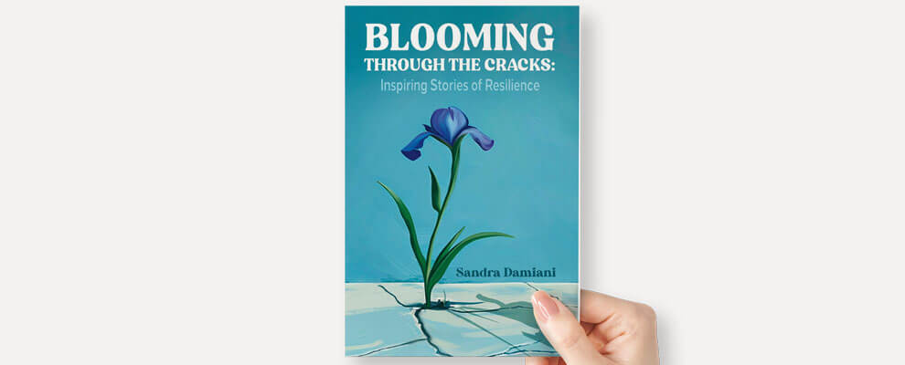 Cover of Blooming Through the Cracks: Inspiring Stories of Reslience by Sandra Damiani